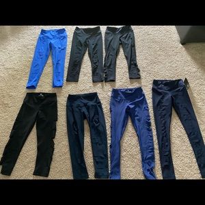 SEVEN pairs of cutout workout leggings.